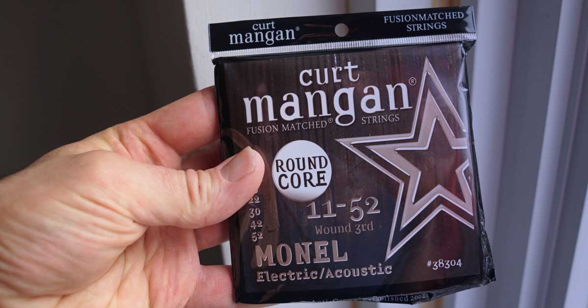 A set of Curt Mangan Monel Steel strings for acoustic guitar