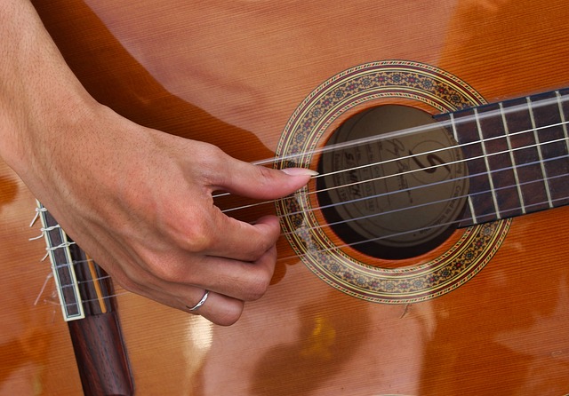 A thumb on classical guitar performing Alzapua