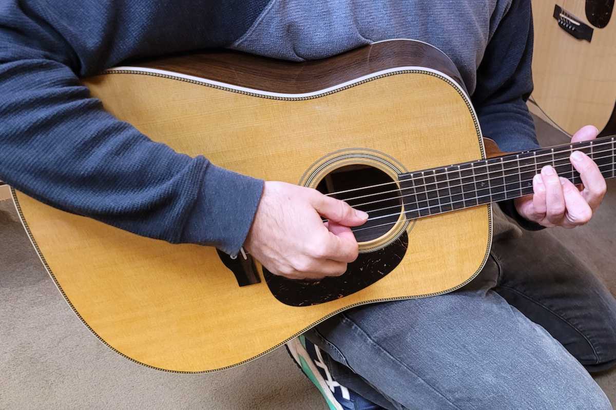Brett playing a Martin OM-28 acoustic guitar