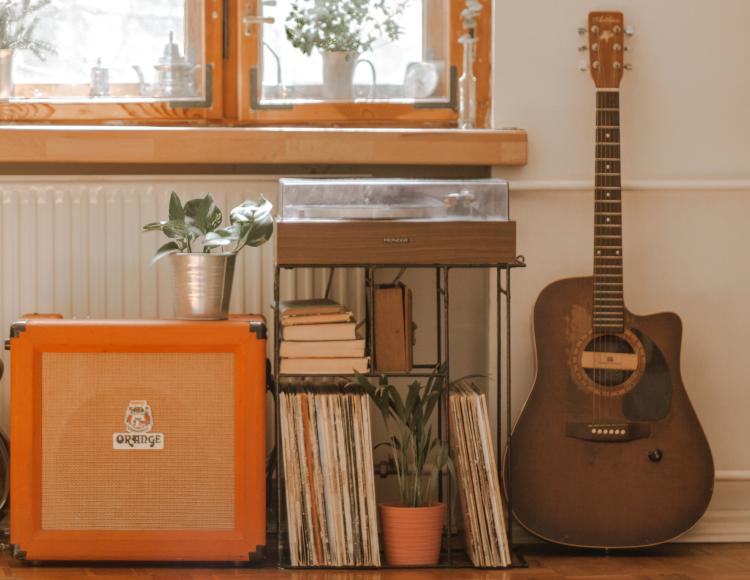 guitar with amp and record player